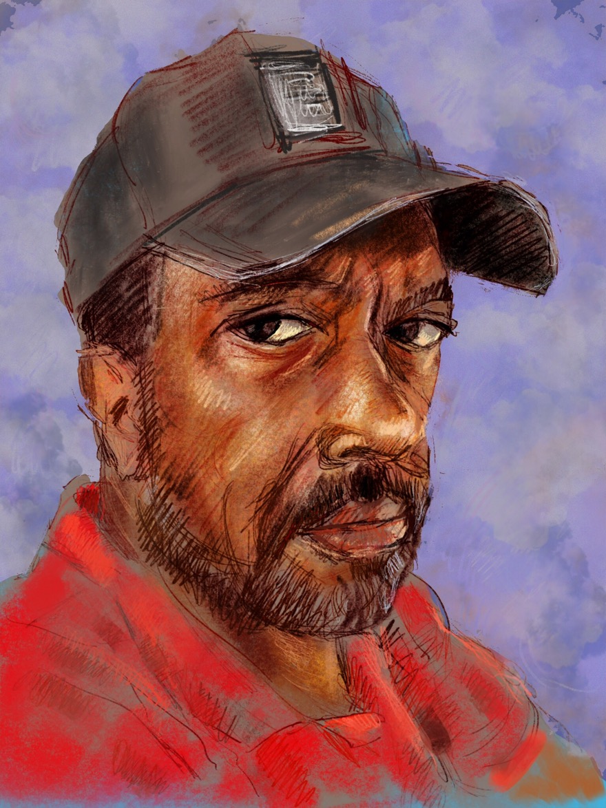 portrait of a bearded man wearing a ball cap